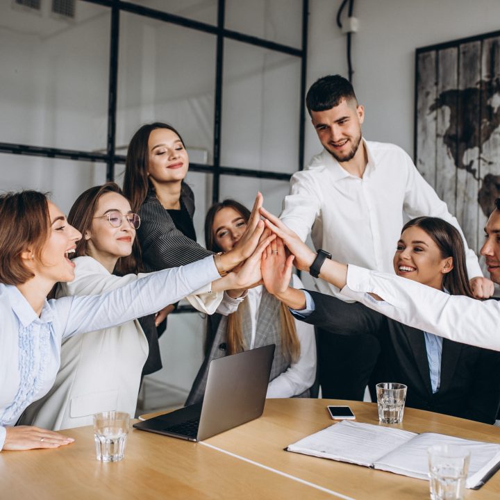 group of people working out business plan in an office